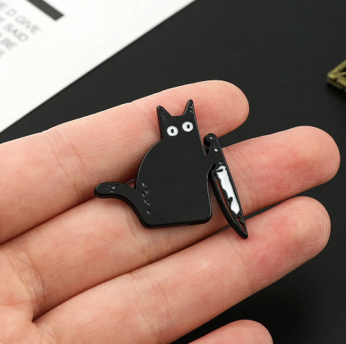 Pin Gato con cuchillo