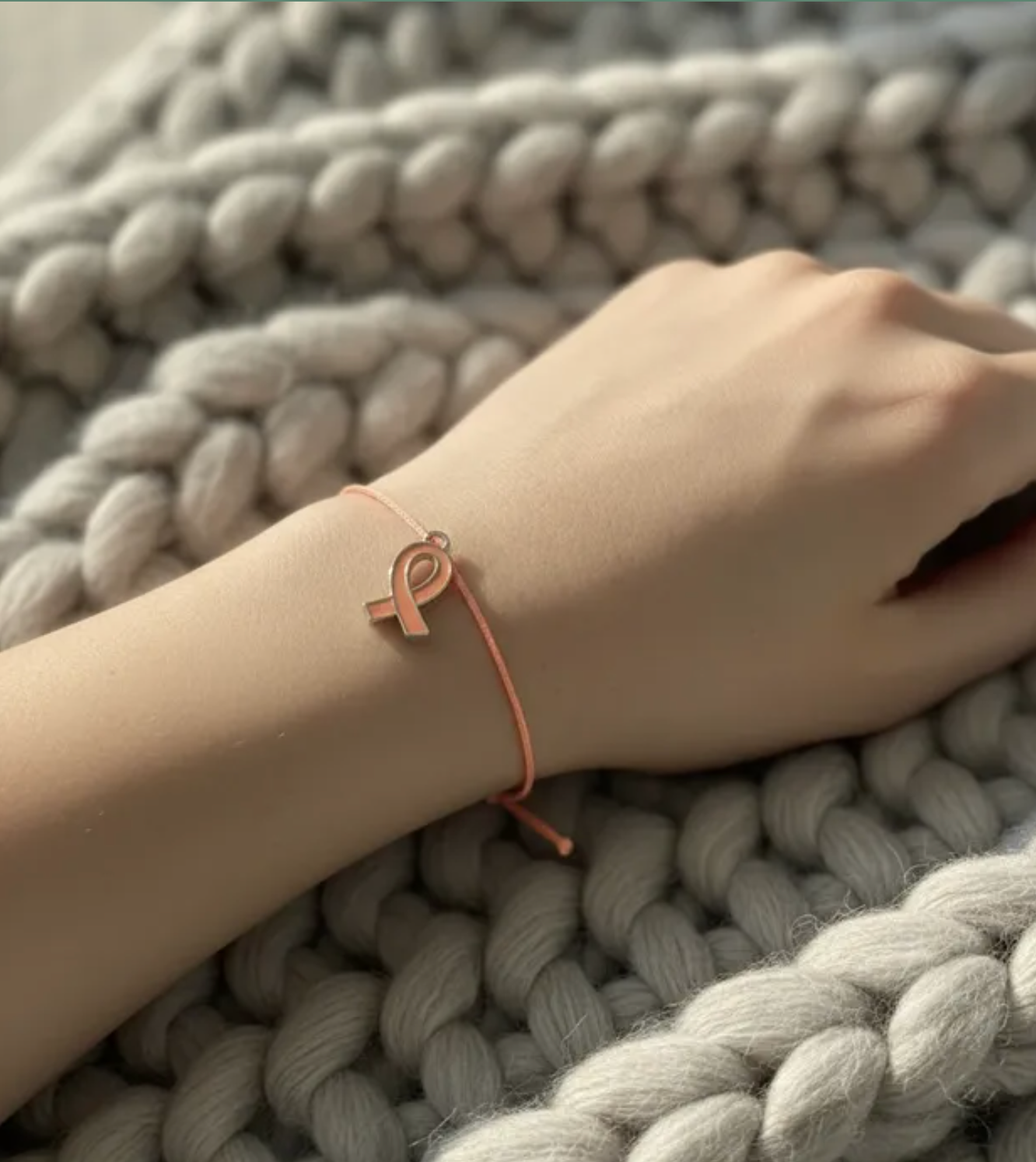 Pulsera Lazo naranja con dije